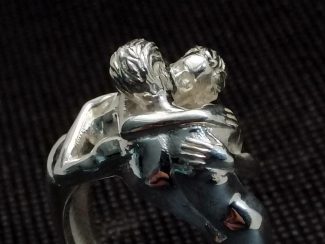 Nude male couple kiss ring